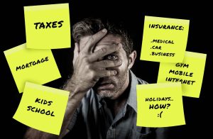 distressed man facing challenging financial times